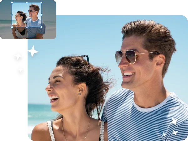 A photo of a couple on the beach being cropped to focus on their joyous faces